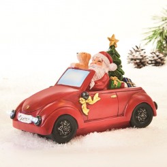 Julemand i bil med lys